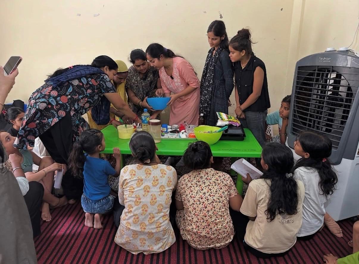 Women and children gathered for a baking workshop